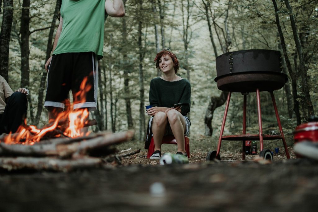 travel as healing: People enjoying a campfire 